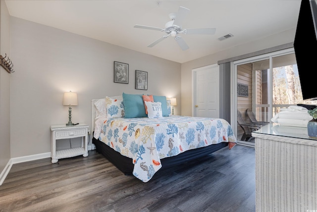 bedroom featuring dark hardwood / wood-style floors, access to exterior, and ceiling fan