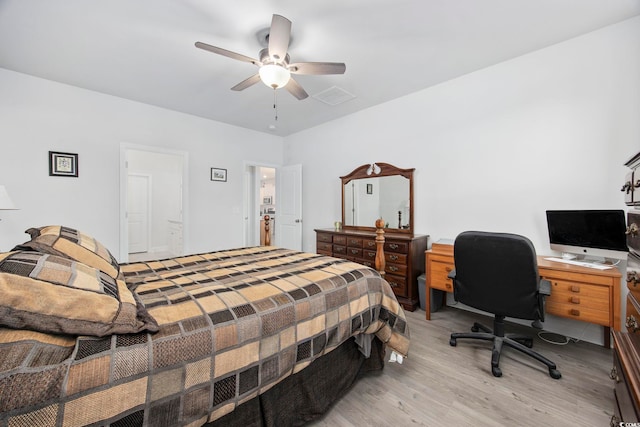 bedroom with a ceiling fan, visible vents, and light wood finished floors