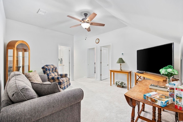 living room with arched walkways, visible vents, a ceiling fan, light carpet, and vaulted ceiling