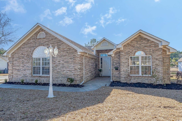 view of front of property featuring brick siding