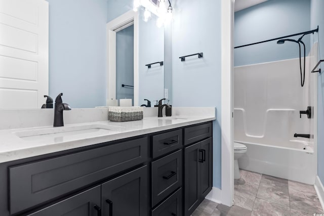 full bathroom featuring vanity, toilet, and washtub / shower combination