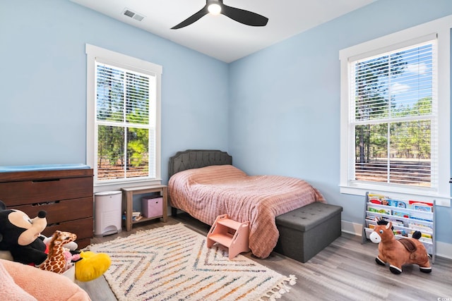 bedroom featuring light hardwood / wood-style flooring and ceiling fan