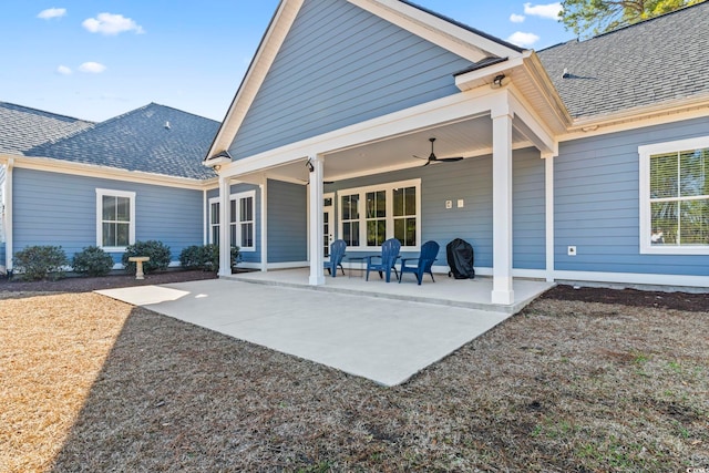 rear view of property with a patio and ceiling fan