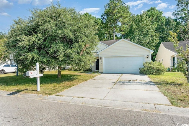 view of front of house with a garage and a front yard