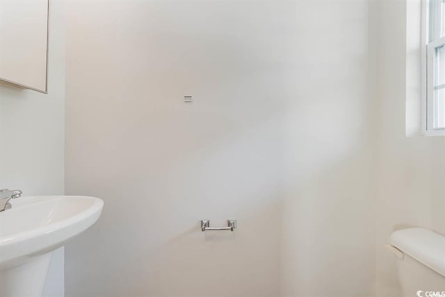 bathroom with sink and toilet