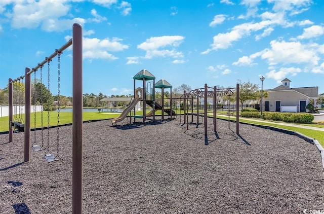 view of playground with a water view