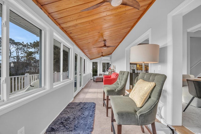 sunroom with ceiling fan, vaulted ceiling, and wooden ceiling