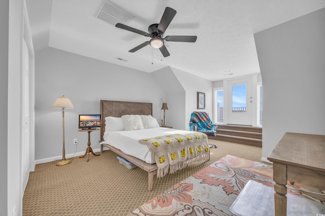 bedroom featuring vaulted ceiling, ceiling fan, and light colored carpet