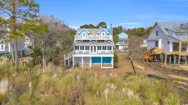 back of property with a balcony