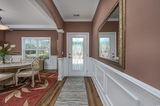 doorway to outside with crown molding and dark hardwood / wood-style flooring