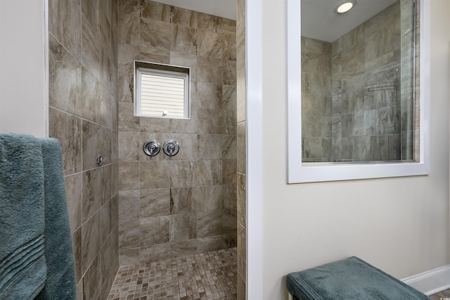 bathroom featuring a tile shower