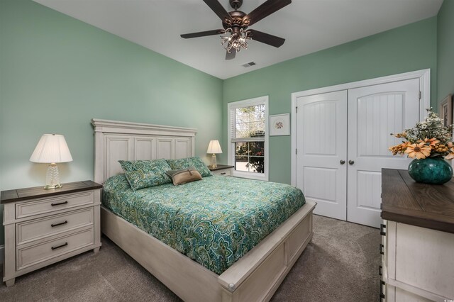 sitting room with ceiling fan, vaulted ceiling, and carpet