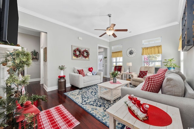 living room with baseboards, ornamental molding, ceiling fan, and wood finished floors