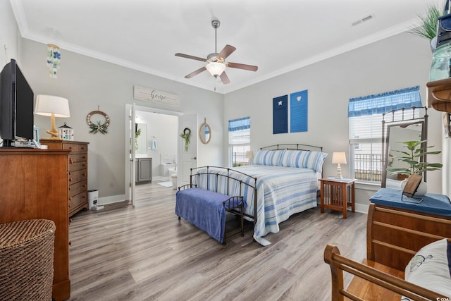 bedroom with light wood-type flooring, visible vents, crown molding, and multiple windows