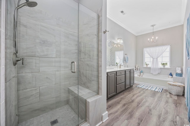 full bath featuring a stall shower, visible vents, wood finished floors, crown molding, and a bath