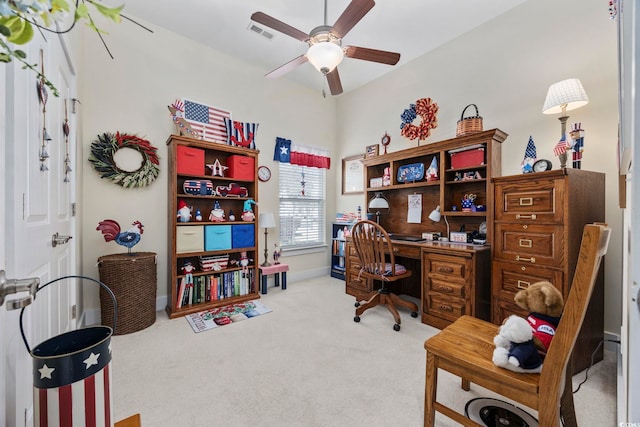 carpeted home office featuring ceiling fan, visible vents, and baseboards