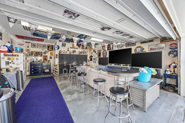 interior space with finished concrete flooring and a workshop area