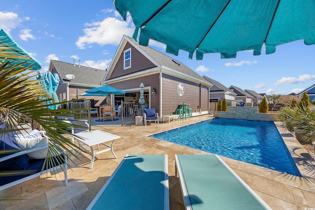 view of swimming pool featuring a patio area and a fenced in pool