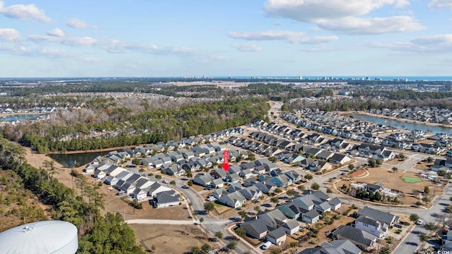 bird's eye view featuring a water view and a residential view