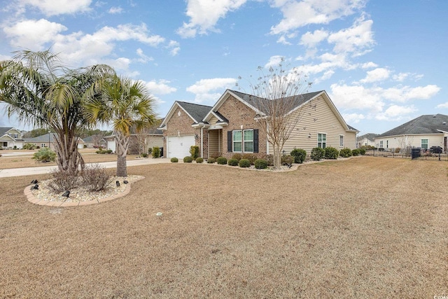 ranch-style house featuring concrete driveway, a garage, fence, and brick siding