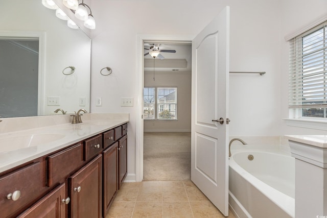 bathroom featuring a sink, a garden tub, double vanity, and tile patterned flooring