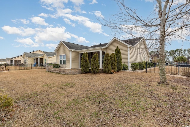 view of front of property with a front lawn and fence