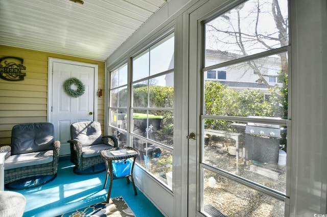sunroom with french doors and vaulted ceiling