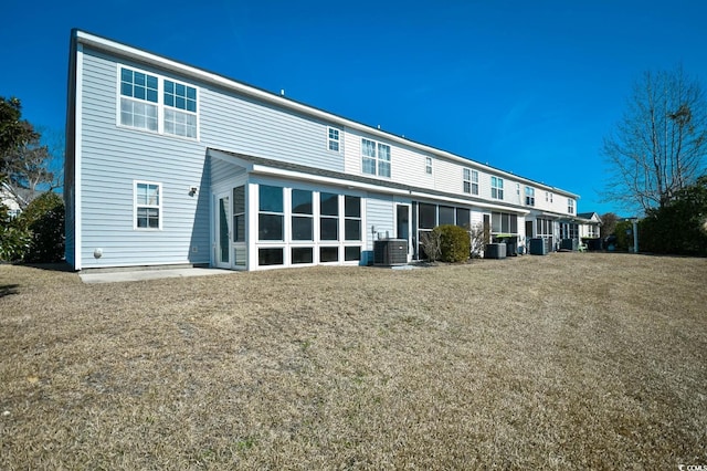 rear view of property featuring central air condition unit