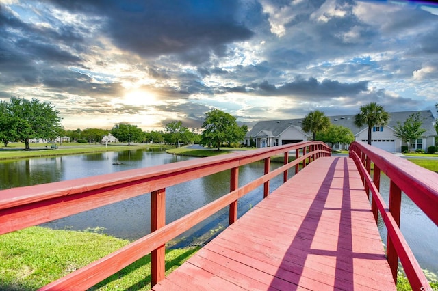 dock area with a water view and a residential view