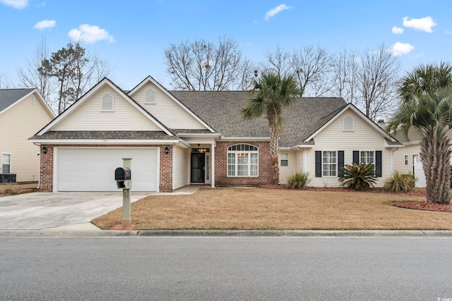 view of front of house with roof with shingles, driveway, a garage, and brick siding