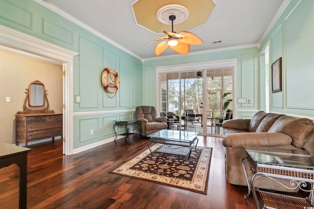 living room featuring crown molding, dark hardwood / wood-style floors, and ceiling fan