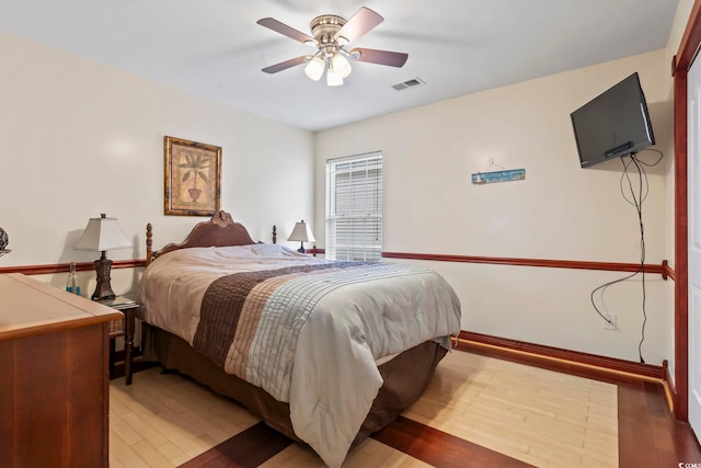 bedroom featuring hardwood / wood-style flooring and ceiling fan