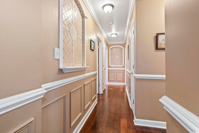 hall with dark hardwood / wood-style flooring and crown molding