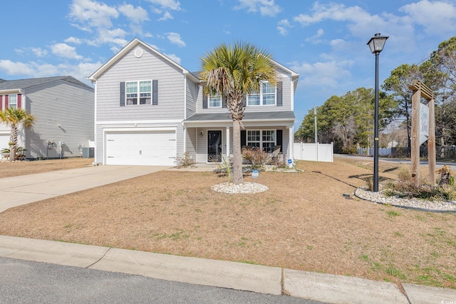 view of front of home featuring a garage, central AC, and a front lawn