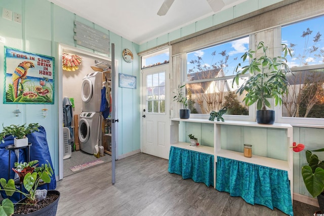 interior space featuring stacked washer / dryer