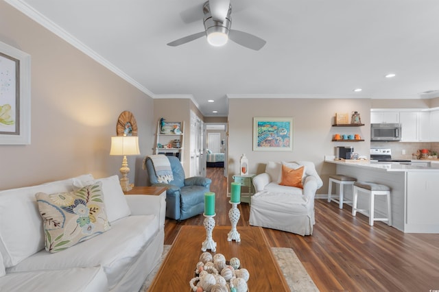 living room with ornamental molding, ceiling fan, and dark hardwood / wood-style flooring