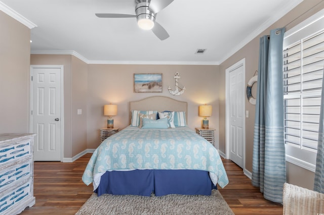 bedroom featuring ceiling fan, ornamental molding, and dark hardwood / wood-style floors