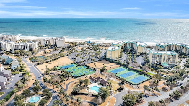 birds eye view of property with a water view and a view of the beach