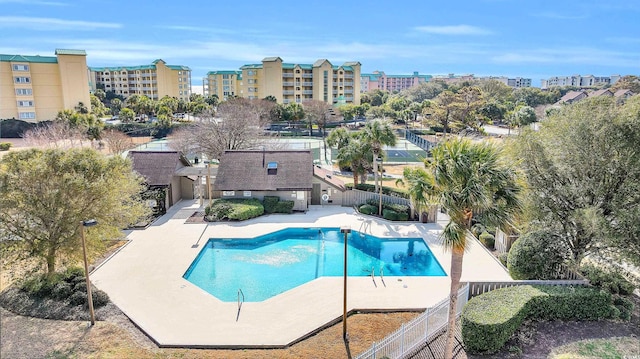 view of swimming pool featuring a patio area