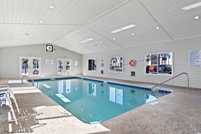 view of swimming pool with french doors