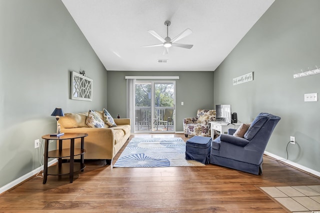 living room featuring lofted ceiling, wood-type flooring, and ceiling fan