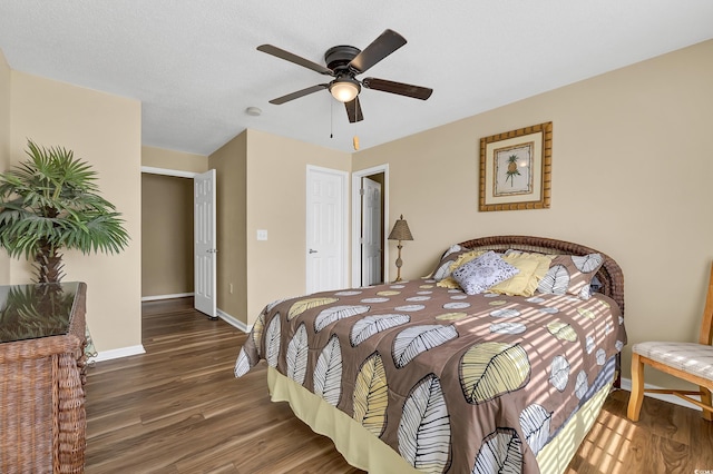 bedroom featuring dark wood-type flooring and ceiling fan