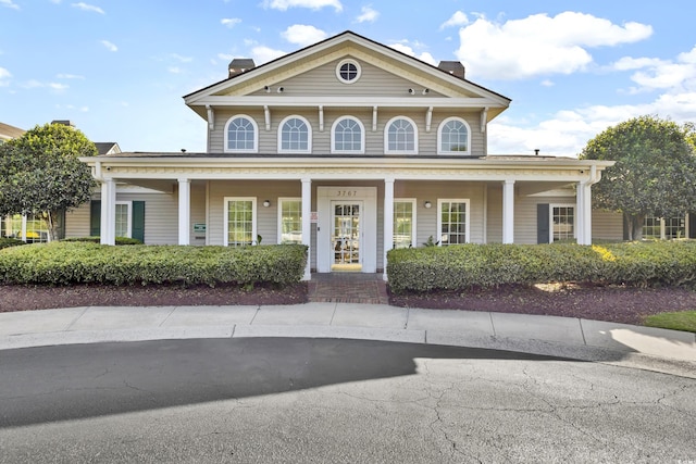 greek revival inspired property with covered porch