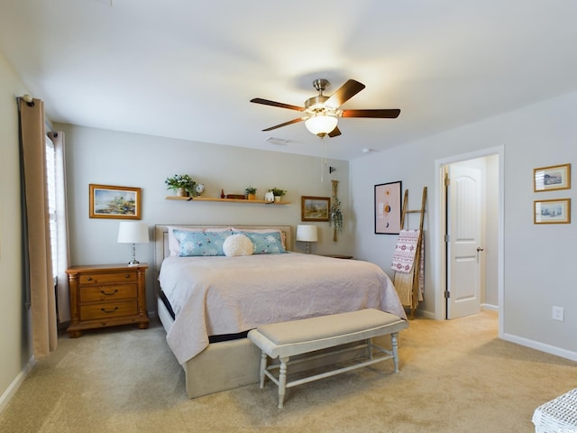 bedroom with light colored carpet, ceiling fan, visible vents, and baseboards