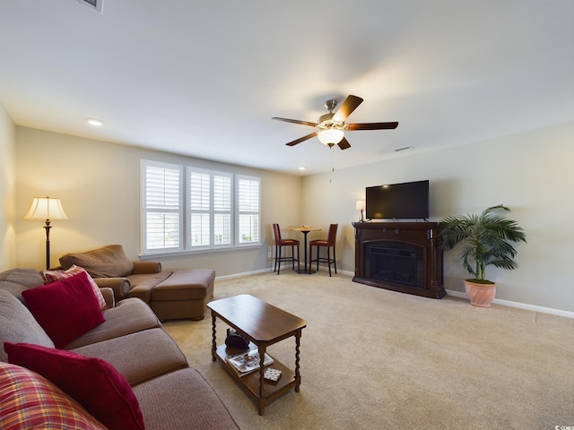 carpeted living room with ceiling fan, recessed lighting, a fireplace, and baseboards