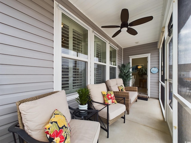 sunroom featuring a ceiling fan