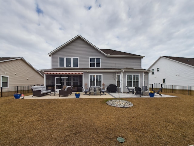 back of property featuring a yard, an outdoor living space with a fire pit, a patio, and a fenced backyard