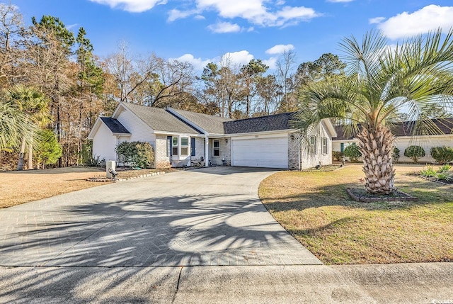 single story home with a garage and a front yard