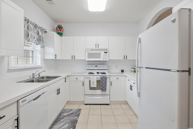 5825 Catalina Dr Unit 332, North Myrtle Beach, SC 29582 - kitchen with white appliances, white cabinets, light countertops, and light tile patterned floors
