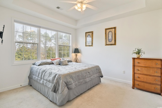 5825 Catalina Dr Unit 332, North Myrtle Beach, SC 29582 - bedroom featuring light colored carpet, a raised ceiling, and ceiling fan